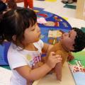 toddler with babydoll
