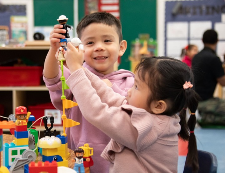 two children stacking toys